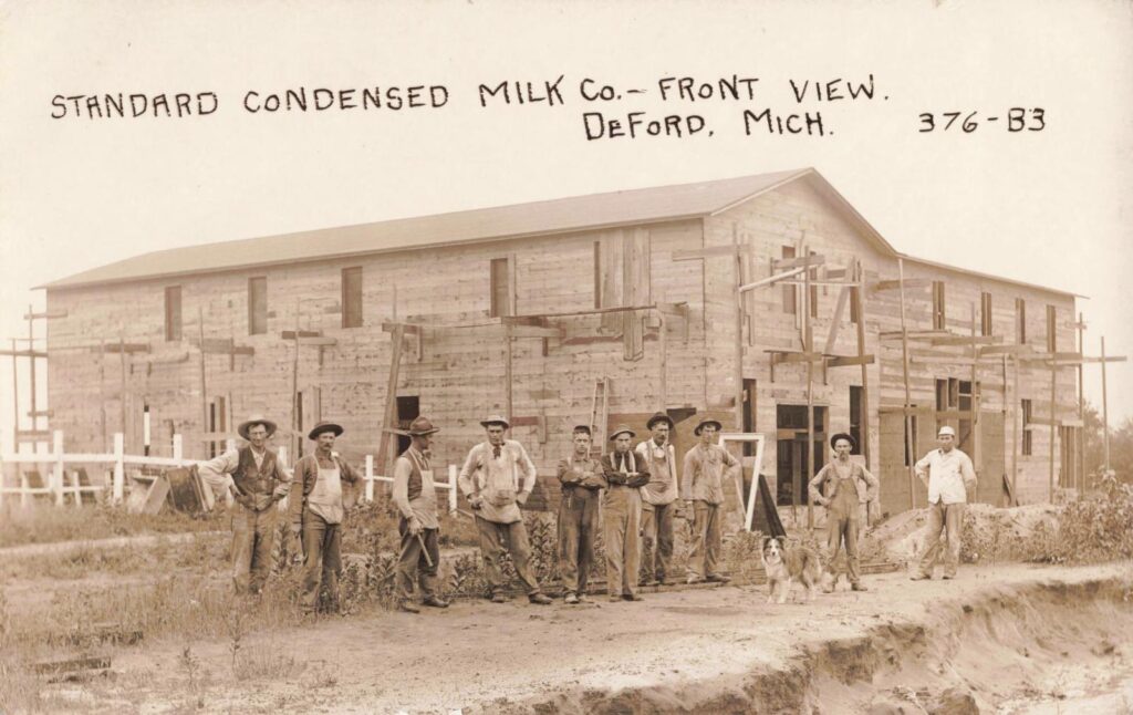 Standard Condensed Milk Company under construction, 1913. The work crew posed outside the new plant as Deford tried to add dairy processing to its grain-and-bean economy. The image captures a short, intense push toward local industry. 