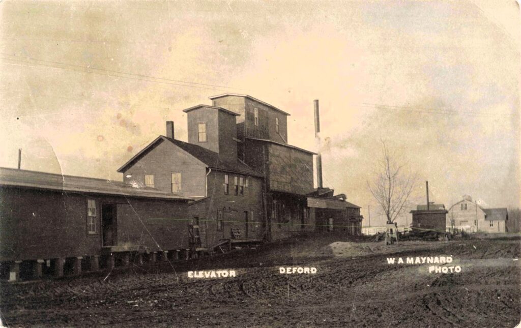The grain elevator served as Deford's economic center, receiving crops from surrounding farms before shipment by rail.
