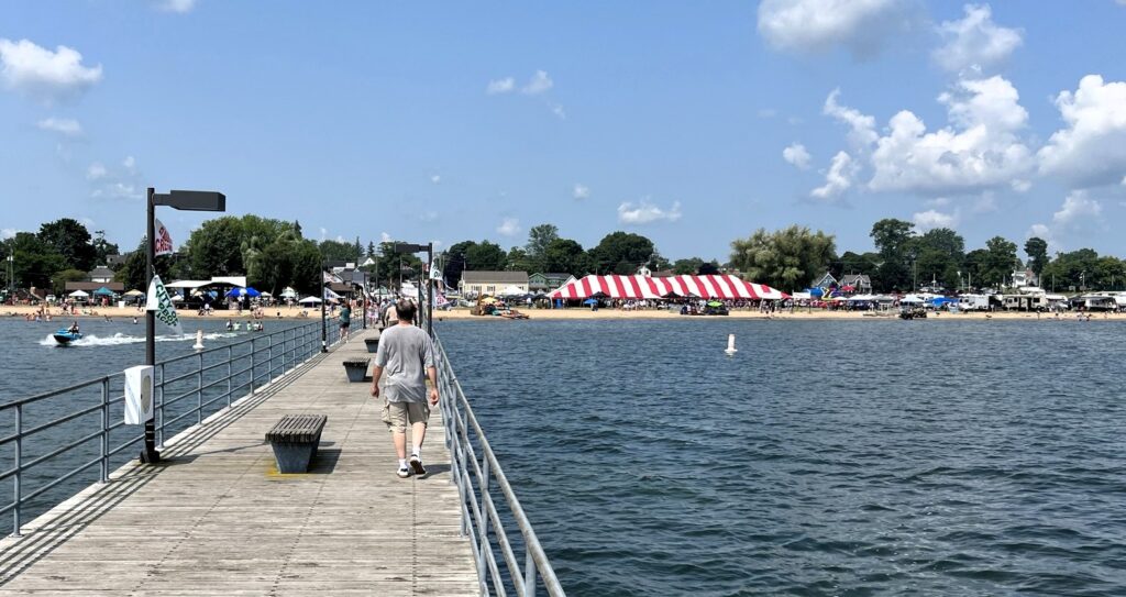 Pier with beach and striped tent