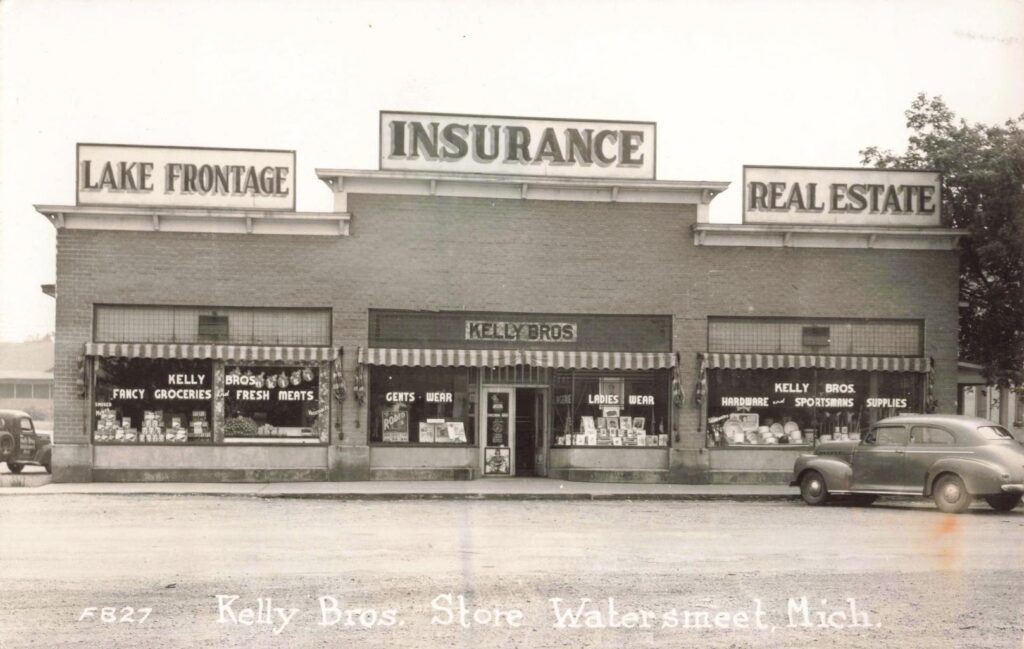 Kelly Bros Store in Watersmeet Michigan with signs for groceries and real estate.