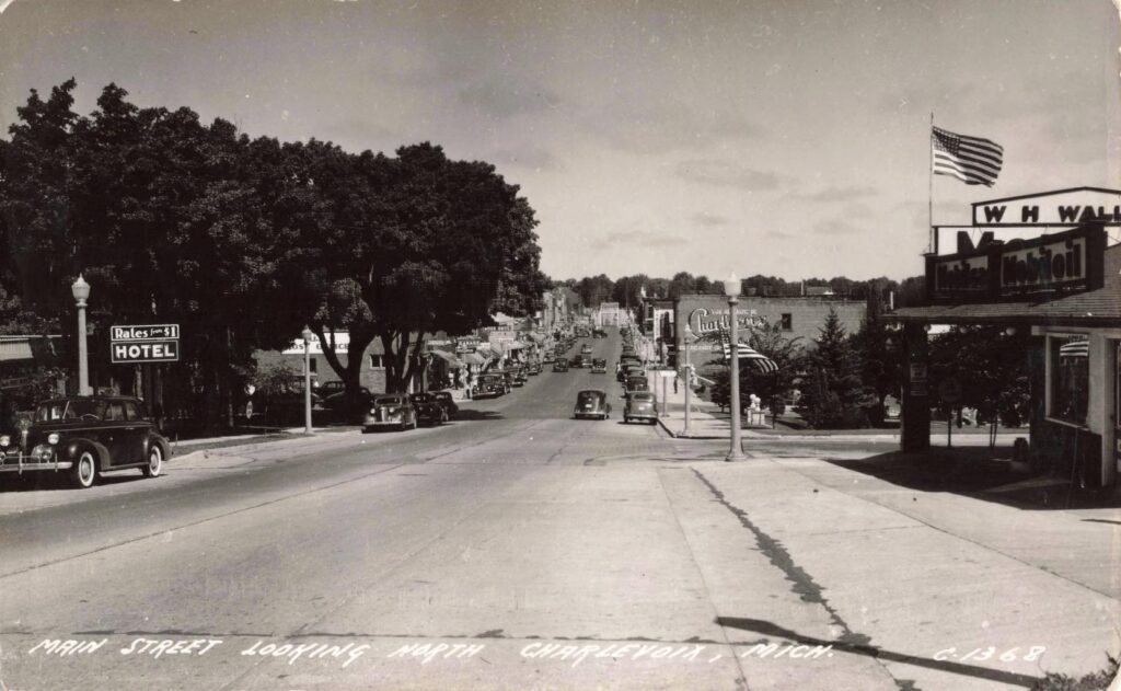 Historic street view with vintage cars