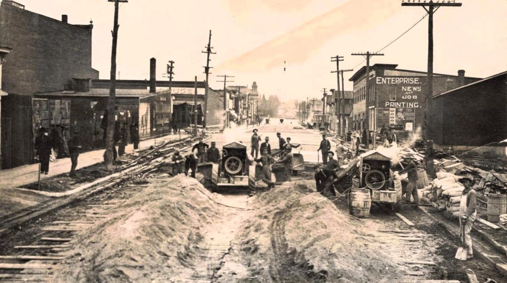 Historic street construction with workers