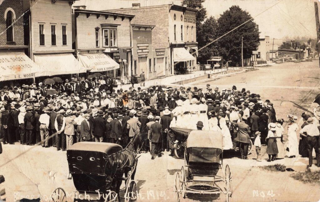 Crowd gathered around a town band during a Fourth of July program in Freeport Michigan in 1914