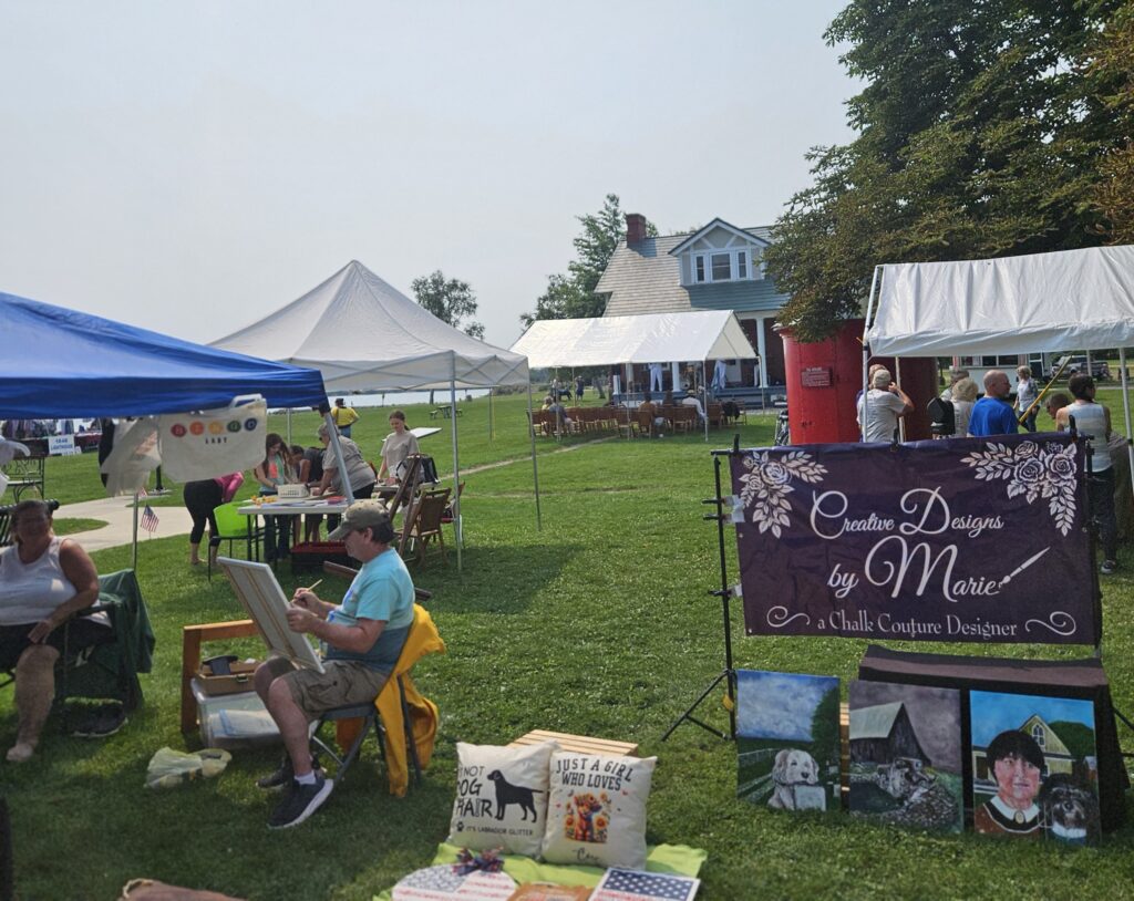 Outdoor market with tents and vendors