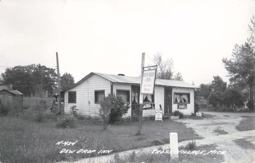 Historic postcard of the Dew Drop Inn in Cross Village, Michigan, advertising lunches, rooms and ice cream