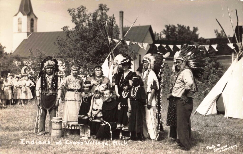 Pictures with tourists at the annual pow-wow at Cross Village.