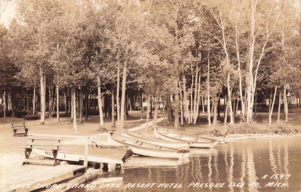 Boats docked by a serene lake.