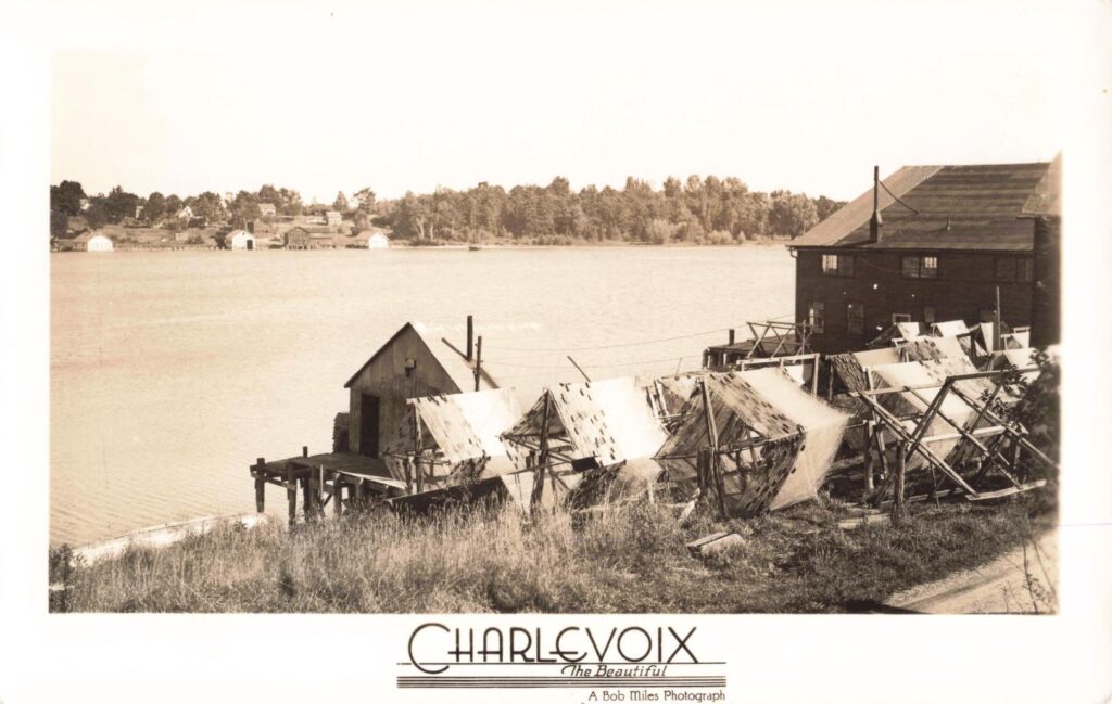 Historic waterfront with fishing structures.