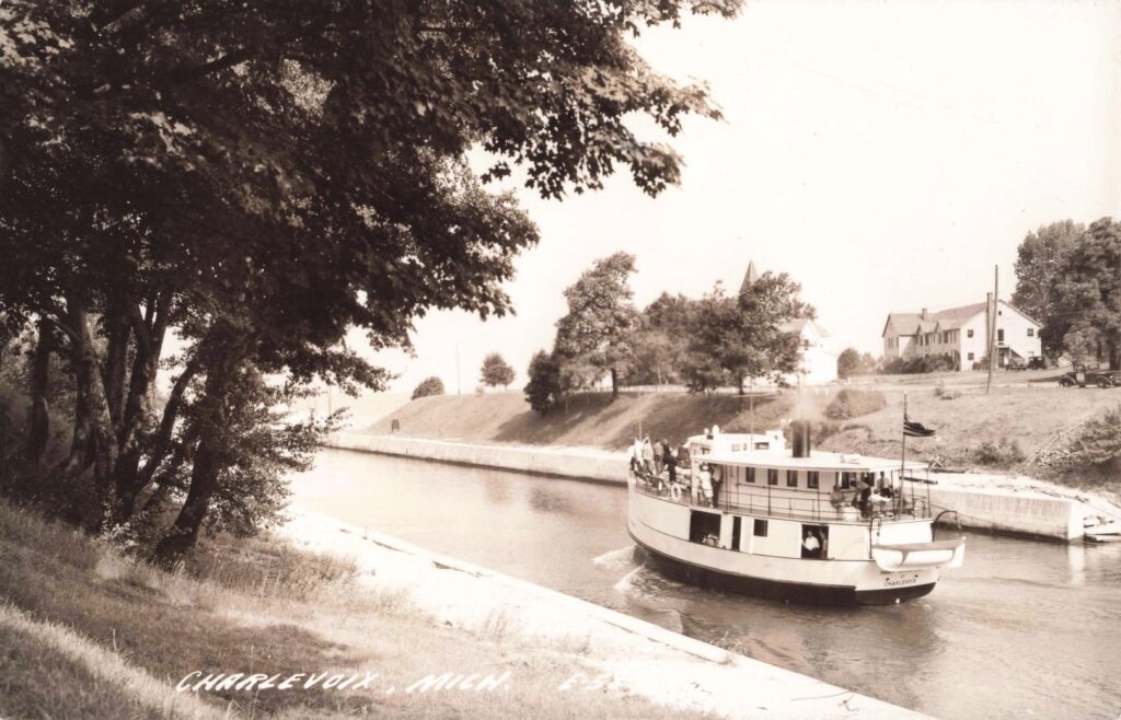 Boat navigating a canal in Charlevoix