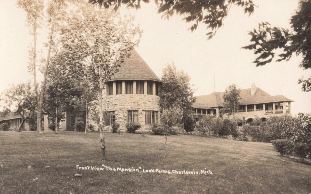 Historic mansion surrounded by trees.