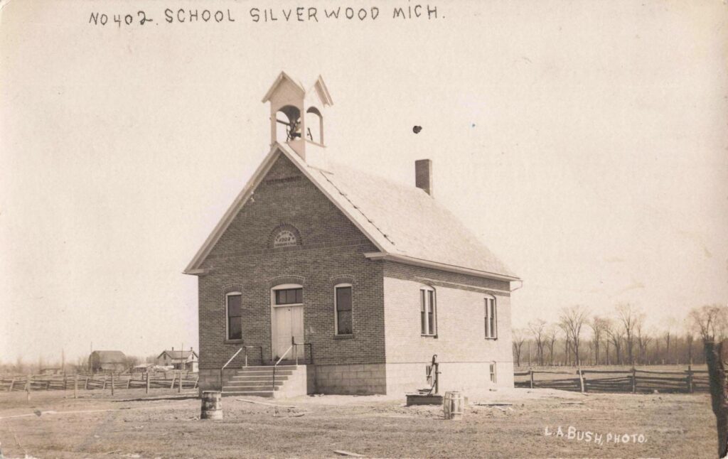 The 1907 Silverwood school included a bell tower, large windows, basement level and hand-operated water pump.