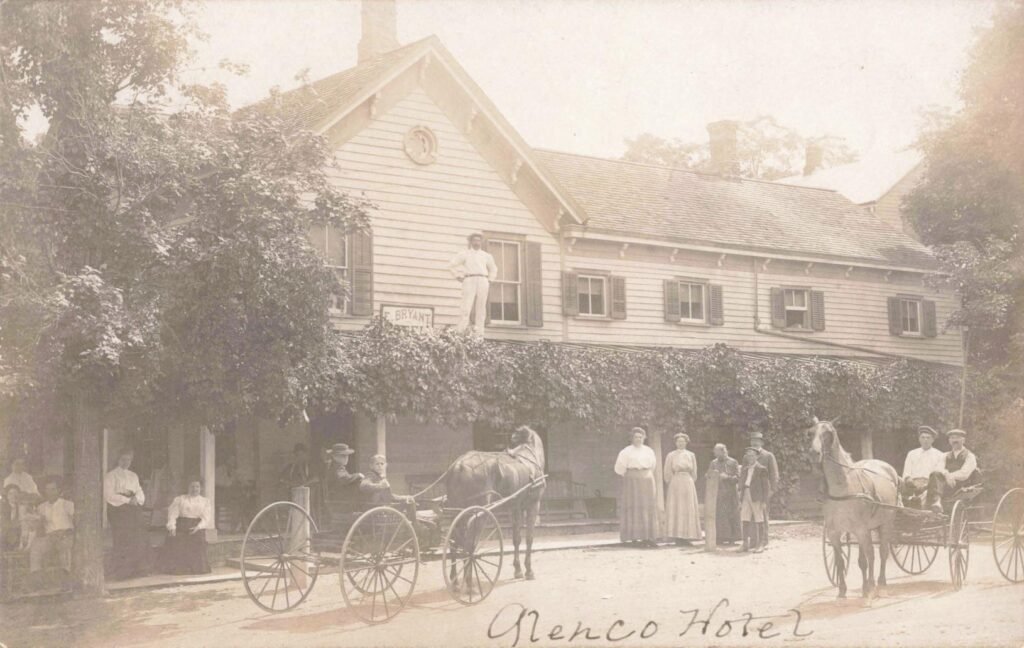 Historic hotel with horse-drawn carriages.