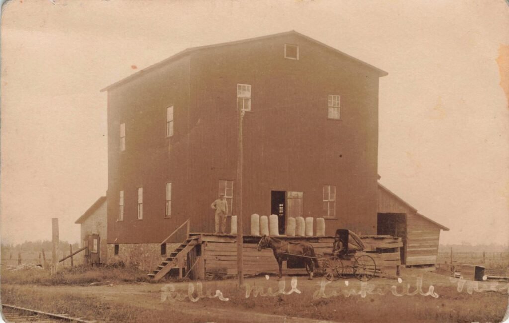 Old mill with horse-drawn cart