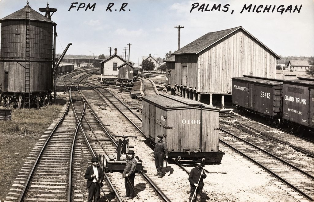 Flint and Pere Marquette railroad yard at Palms Michigan with freight cars and tracks