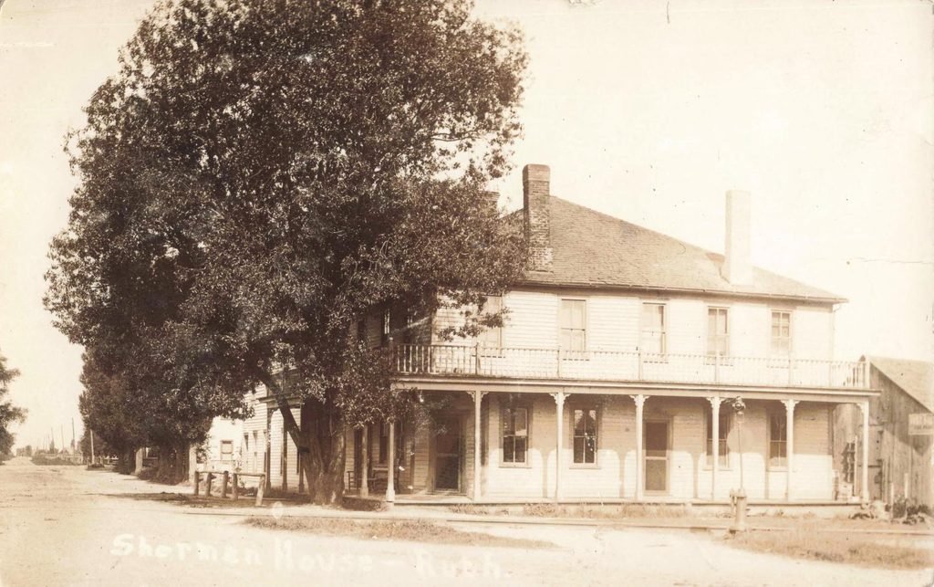 Historic Sherman House hotel with porch in Ruth Michigan
