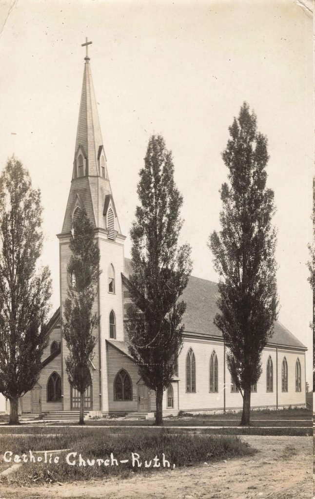 Historic Sts. Peter and Paul Catholic Church in Ruth Michigan with tall wooden steeple