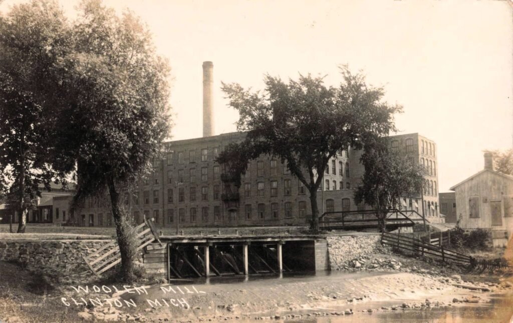 Historic wooden mill by the river.