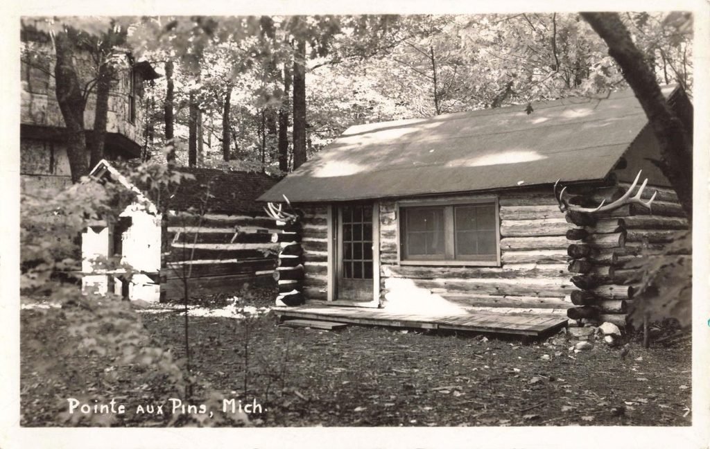 Log cabin in wooded area.