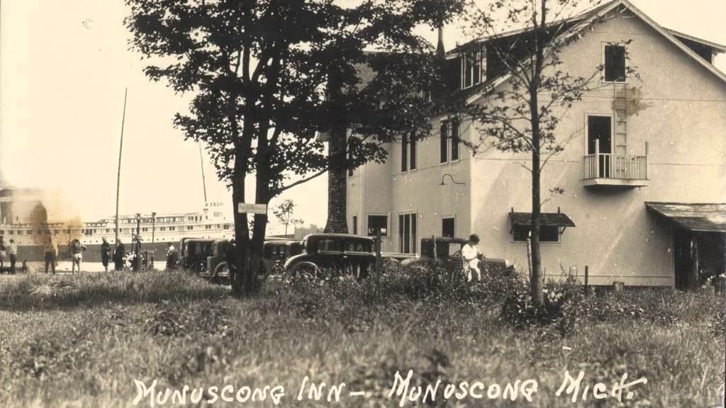 Historic inn with vintage cars outside