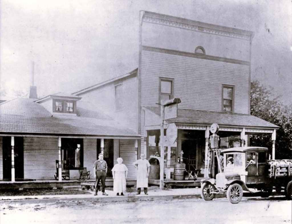 Historic general store with people and car