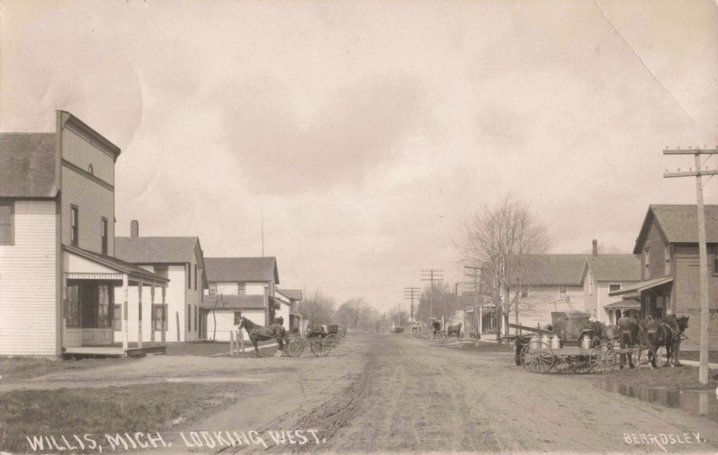 Historic street with horse-drawn carriages