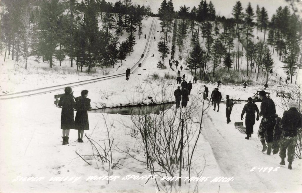 Winter sports in snowy landscape.