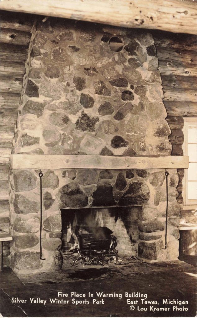 Stone fireplace in rustic cabin