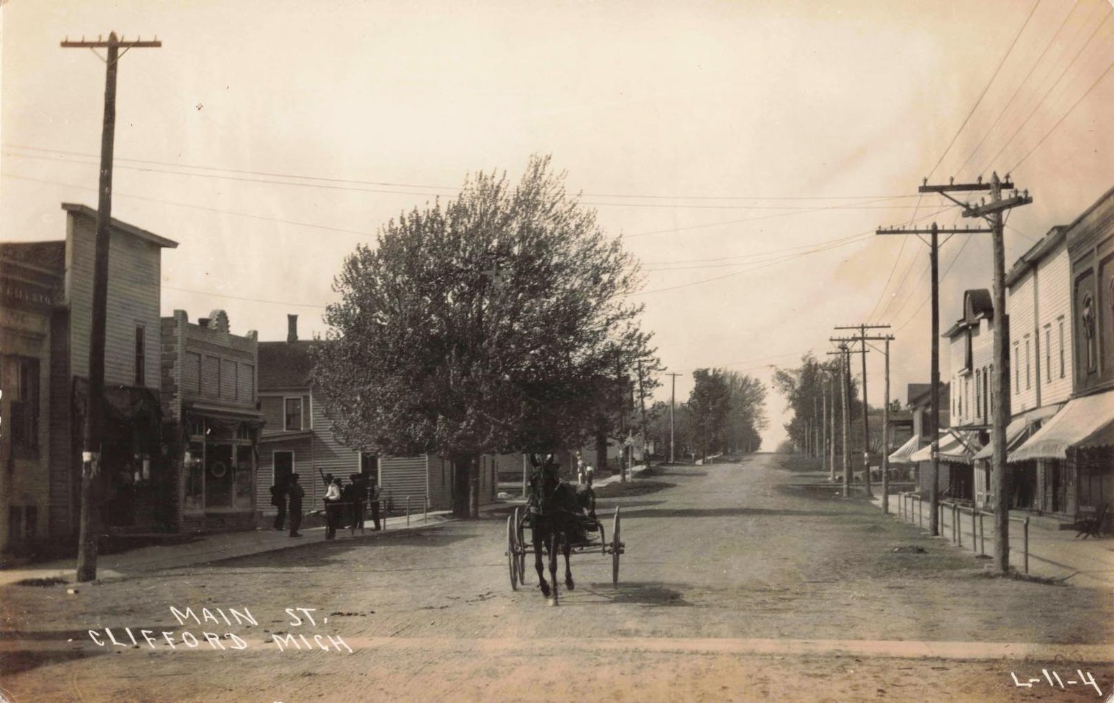 Historic street scene with horse-drawn carriage.