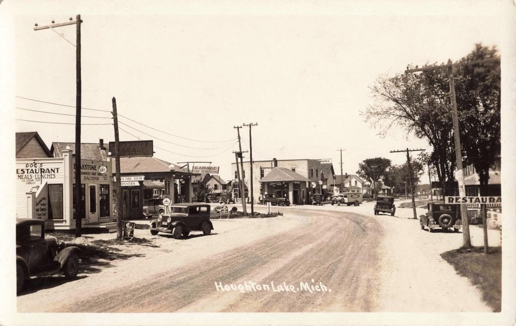 A roadway bends into Houghton lake