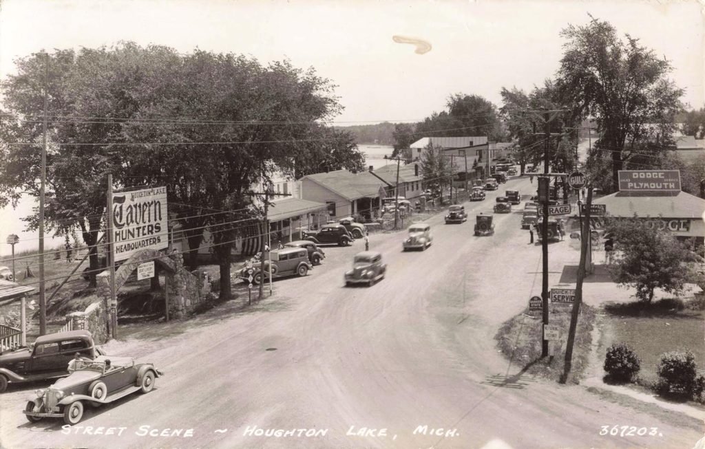 Historic Houghton Lake, Michigan street with Hunters Headquarters tavern sign and vintage cars