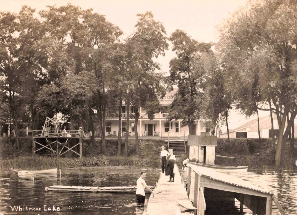 Historic lakeside scene with people